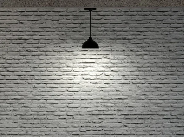 Bakstenen muur en een plafondlamp — Stockfoto