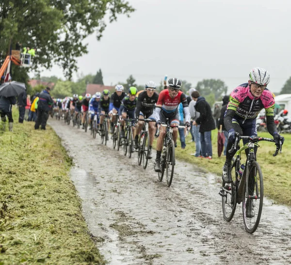 The Peloton on a Cobblestone Road - Tour de France 2014 — Stock Photo, Image