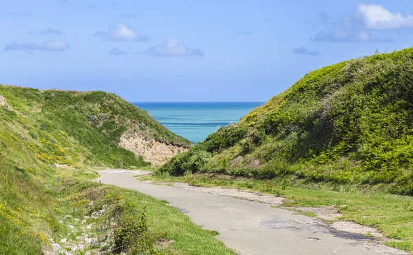 Hidden path to the beach in Normandy.