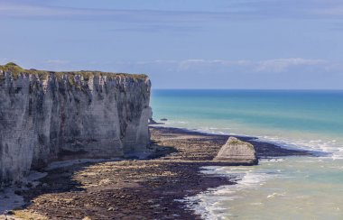 Coastline in Normandy in Northern France, during the low tide time. clipart