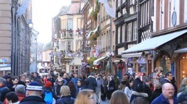 STRASBOURG, FRANCE  DECEMBER 12,2015: Slow motion footage of the crowd walking on the streets during the winter holiday season in Strasbourg, Alsace, France.