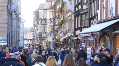 STRASBOURG, FRANCE  DECEMBER 12,2015: Crowd of people walking on the streets during the winter holiday season in Strasbourg, Alsace, France.