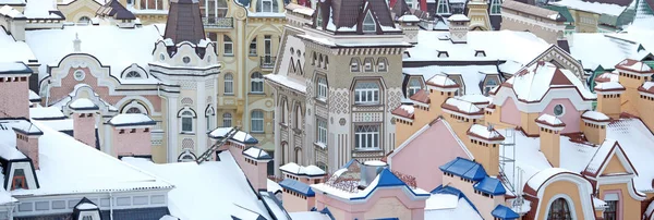 colorful houses and roofs covered with snow
