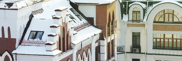 roofs covered with snow in the cold weather