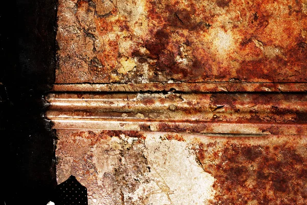 metal background of natural metal bent and beaten surface with old shabby paint of different colors, scratches rust and corrosion formed by time and weather