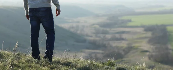 Man Standing Hill Looks Distance Plain Stock Picture