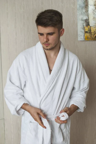 Handsome man in bathrobe