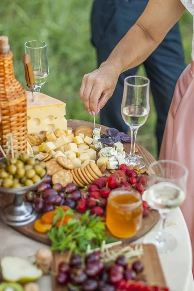 Cheese and fruits on a beautifully vintage decorated table