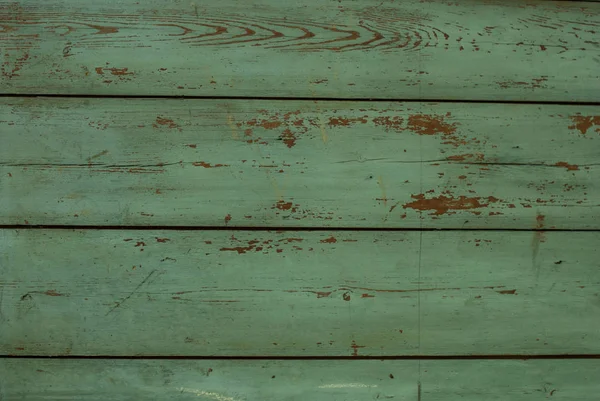 Bordo di legno graffiato verde. Struttura del legno — Foto Stock