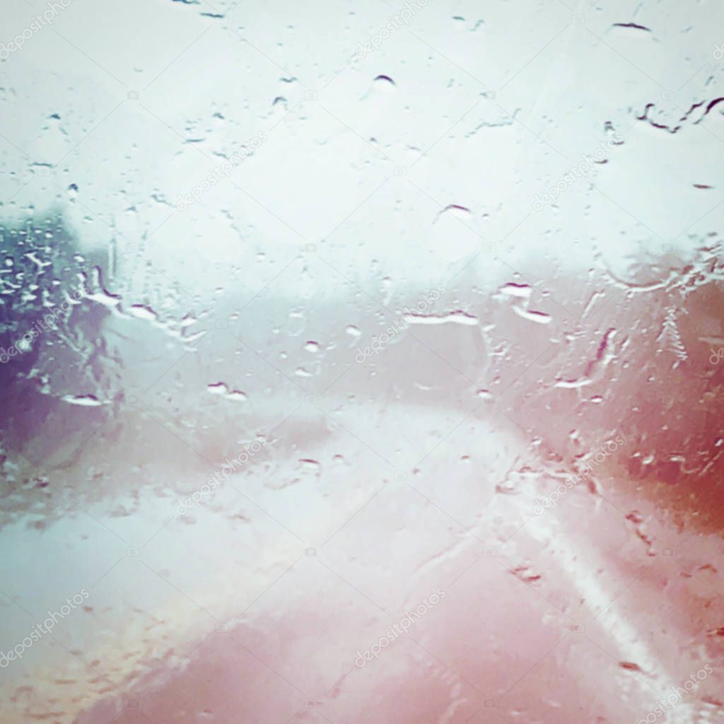 Water on the windshield of car, Driving with view of road with color effects 
