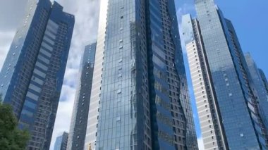 4K Time lapse -Tilting shot for group of skyscrapers with rapid moving clouds background,Fuzhou,Fujian,China