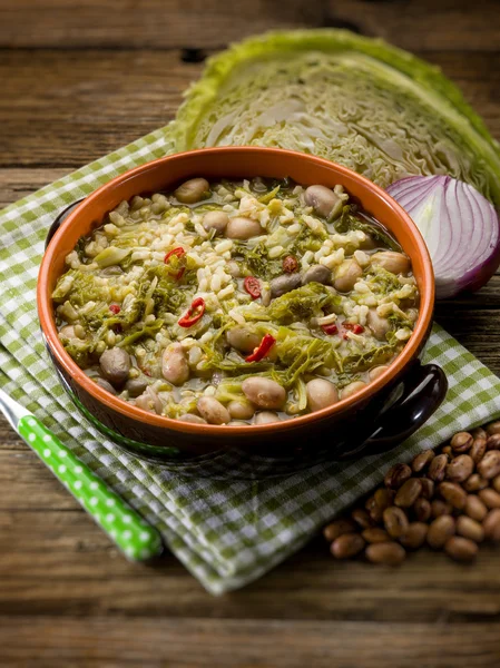 Soup with rice savoy cabbage and beans, selective focus — Stock Photo, Image