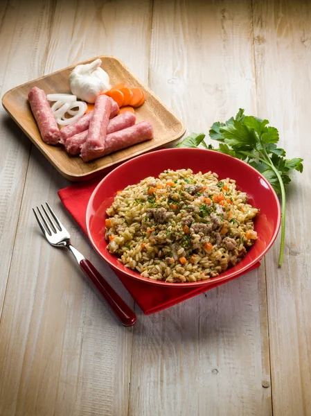 Rice with sausage garlic and carrots — Stock Photo, Image