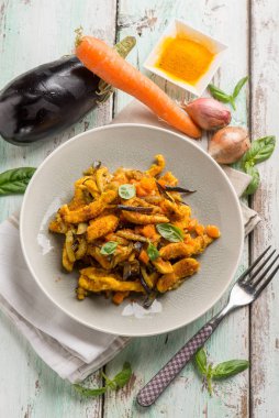 chicken stewed with eggpalnts carrots basil and turmeric spice