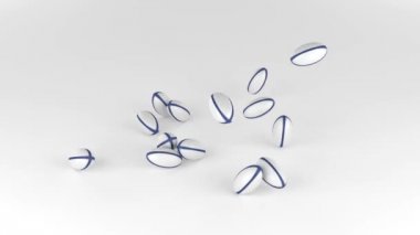 Bazı Rugby düşen ve beyaz bir yerde zıplayan topları