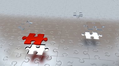 Puzzle parçaları yere tek kırmızı parça ve bir gri her şeyden önce diğer iki beyaz delik