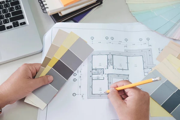 Architect or  Interior designer selects color tones for house pr