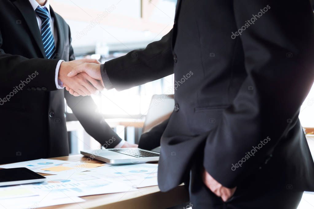 Business partnership meeting concept. Image businessmen handshake. Successful businessmen handshaking after good deal.  