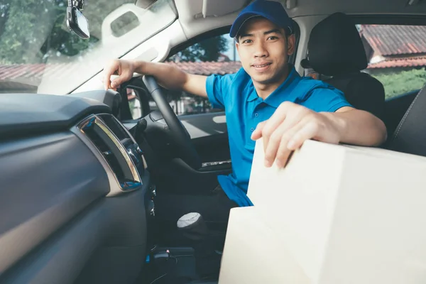 Delivery driver and packages on seat. — Stock Photo, Image