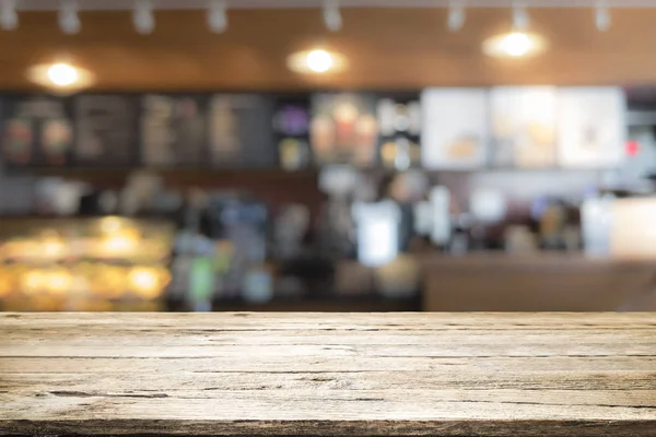 Tampo da mesa de madeira no café café balcão bar fundo — Fotografia de Stock