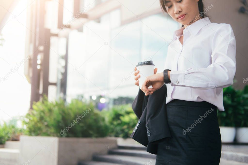 Asian business woman working outdoor.