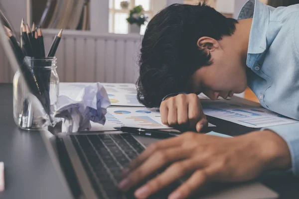 Businessman tried and stressed sleep on working desk. — Stock Photo, Image