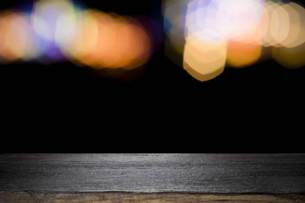 Empty wooden table platform and bokeh at night. — Stock Photo, Image