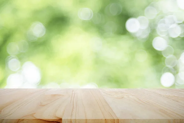 Table vide pour le produit actuel avec bokeh vert — Photo