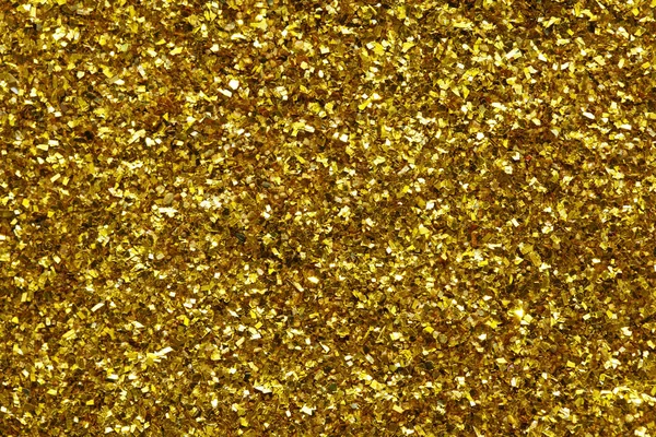 Gnistrande gyllene Glitter bakgrund Stockfoto