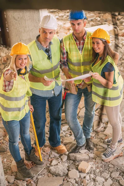 Construction architects review plan — Stock Photo, Image