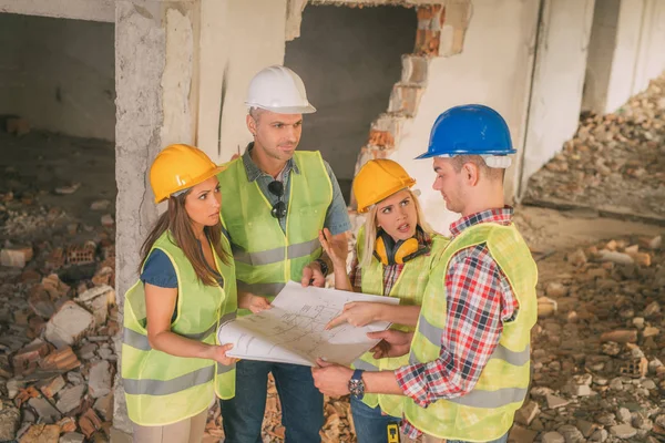 Construction architects review plan — Stock Photo, Image