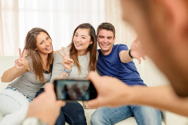 Friends taking photo at house party — Stock Photo, Image