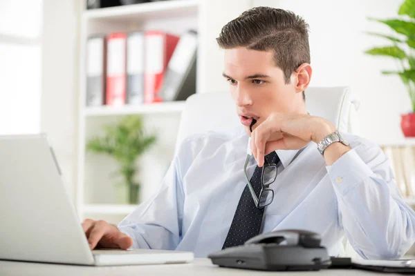 Businessman sitting at office — Stock Photo, Image