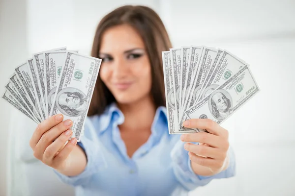 Business woman holding money in hands — Stock Photo, Image