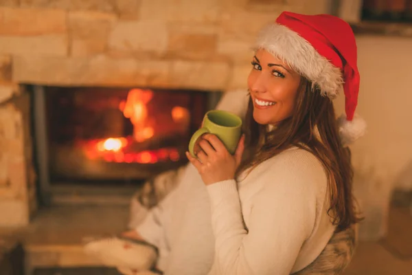 Woman Enjoying By The Fireplace — Stock Photo, Image