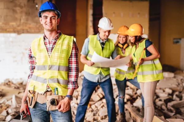 Architect posing in damaged building — Stock Photo, Image