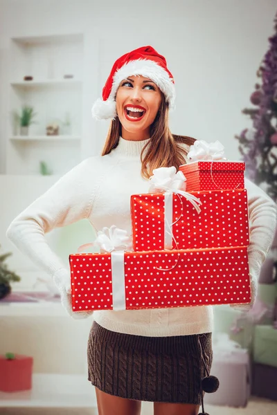 Cheerful woman holding presents — Stock Photo, Image