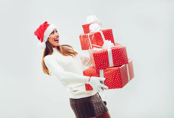 Cheerful woman holding presents — Stock Photo, Image