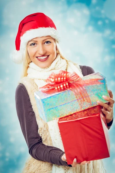 Cute blonde holding gifts — Stock Photo, Image