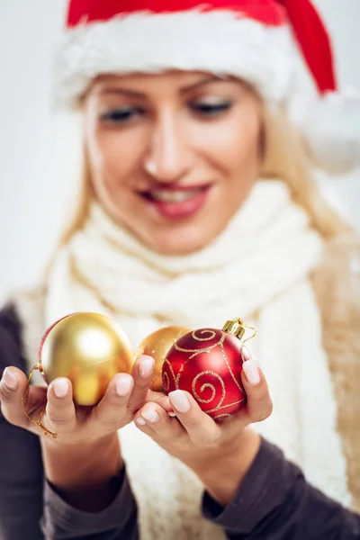 Blonde girl holding balls — Stock Photo, Image