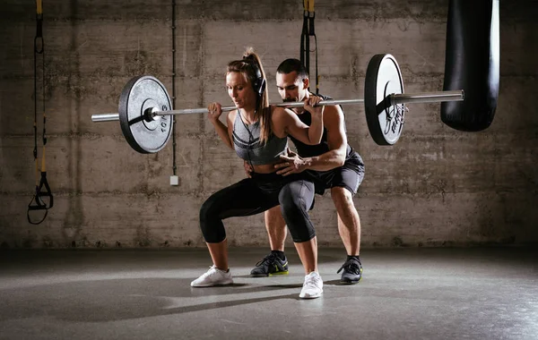 Woman doing hard exercise — Stock Photo, Image