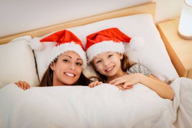 Mom And Daughter With Santa Hats