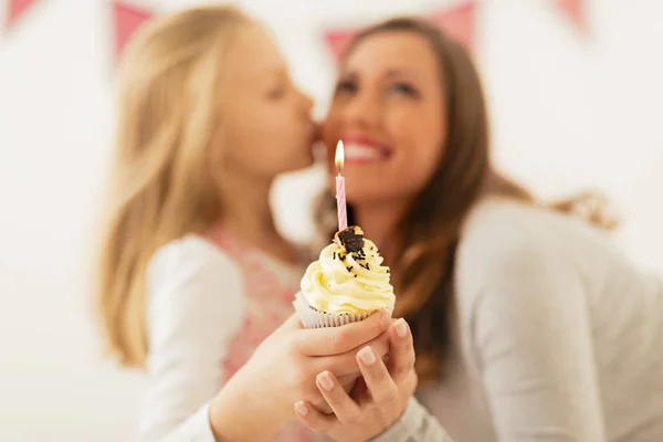 Cute Little Girl Giving Small Cupcake Candle Her Smiling Mom — Stock Photo, Image
