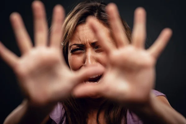 Young Abused Woman Defending Pray Looking Camera Outstretched Arm Selective — Stock Photo, Image