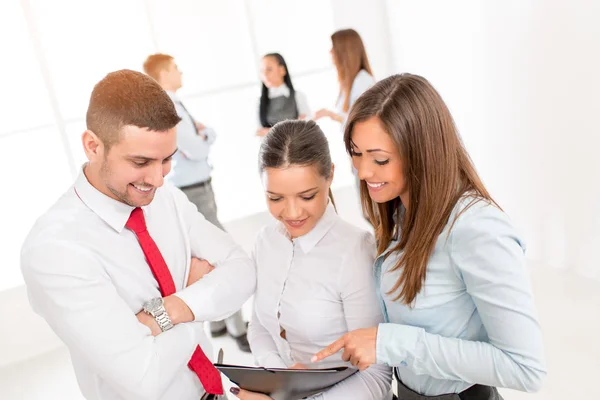 Three Young Colleagues Discussing Front Business Team — Stock Photo, Image