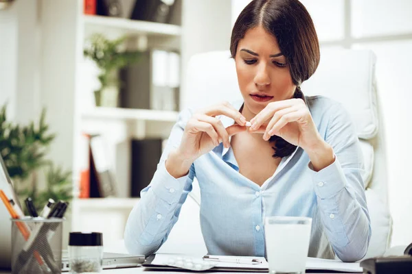 Stressed young woman sitting — Stock Photo, Image
