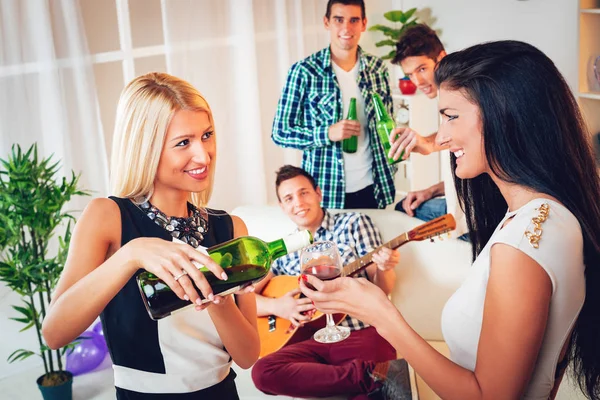 Young Woman Pouring Red Wine Friends Glass — Stock Photo, Image