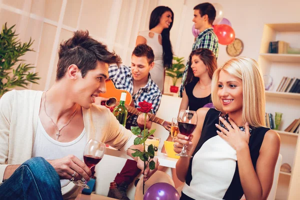 Young Man Presenting Rose Girlfriend Party — Stock Photo, Image