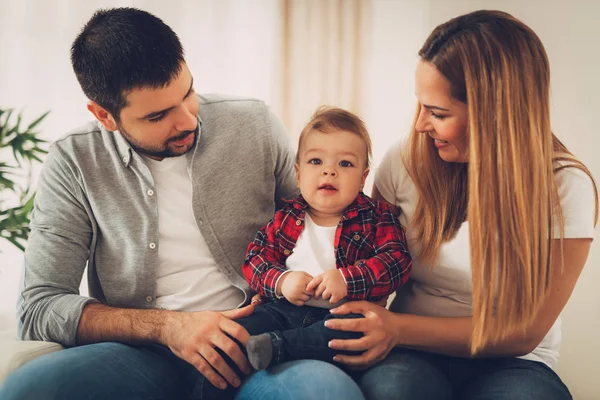 Beautiful Baby Boy Enjoying Home His Parents Sitting Sofa Looking — Stock Photo, Image