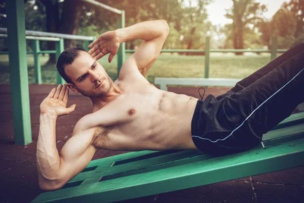 Young Urban Muscular Sportsman Doing Sit Ups Exercise Outdoor — Stock Photo, Image